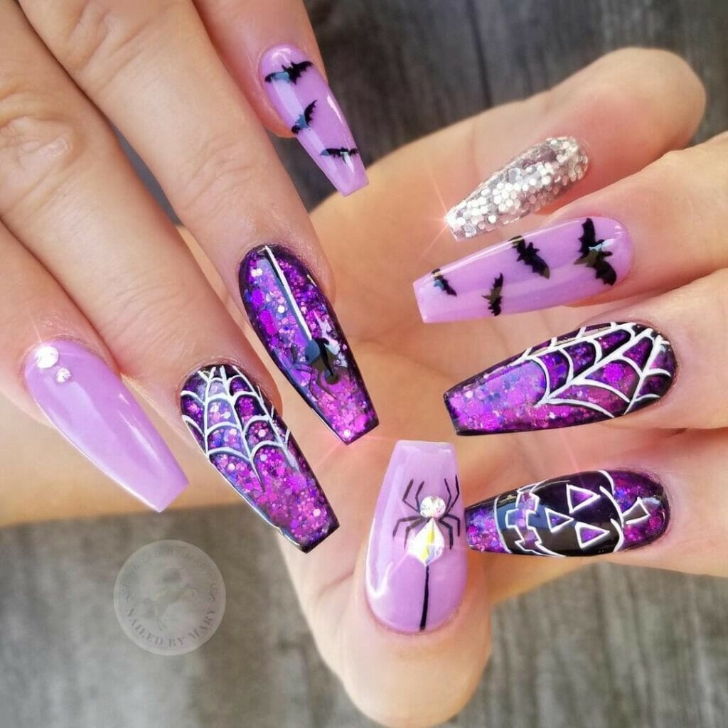 Purple-bat-and-sparkly-Halloween-Nails