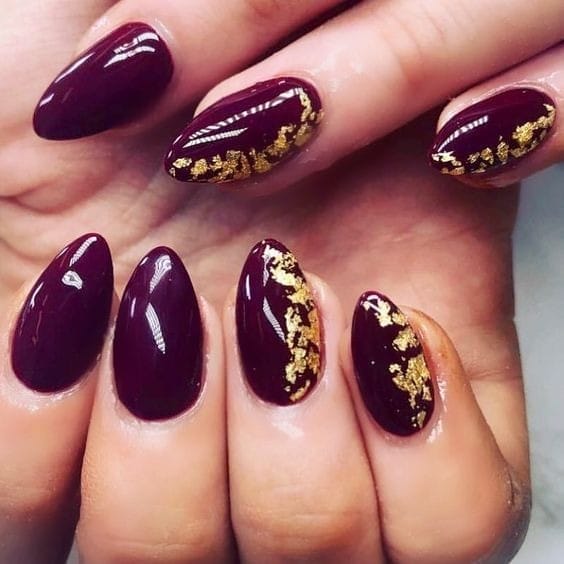 A Touch of Gold Foils burgundy nails