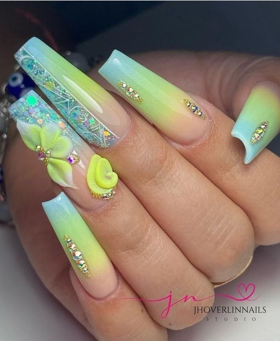 long Blue and Yellow nails with gems
