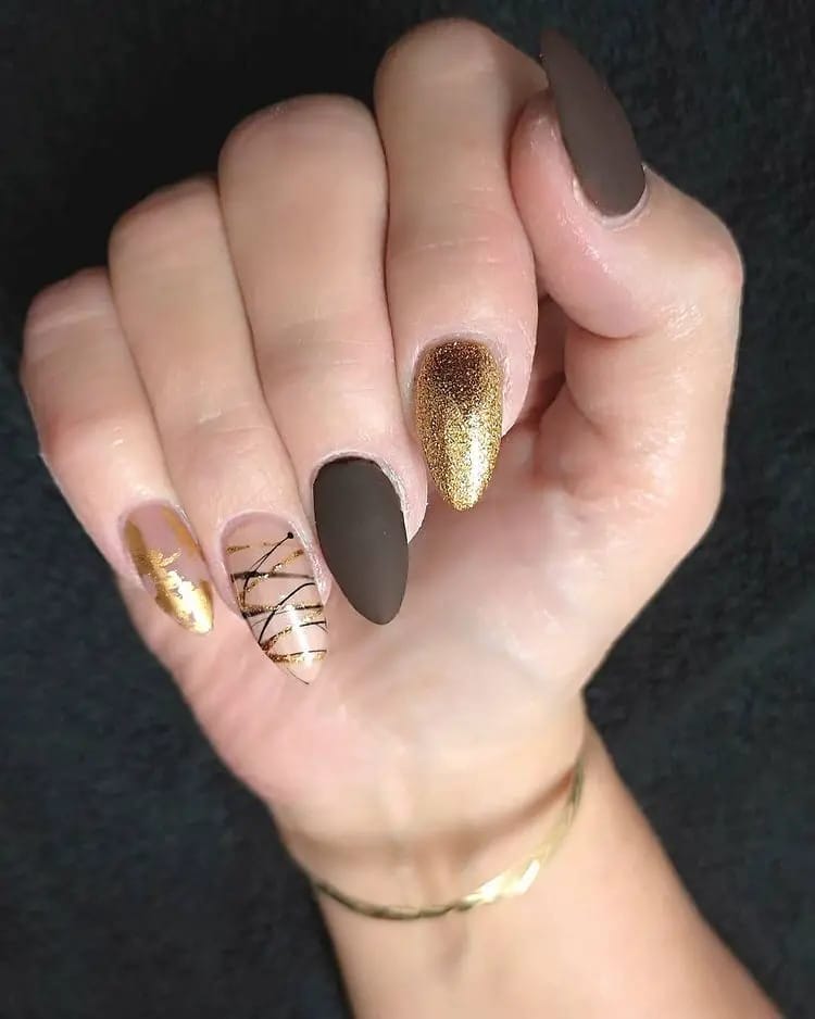 Dark Brown and Gold Glitter Almond Nails With Criss-Cross Lines