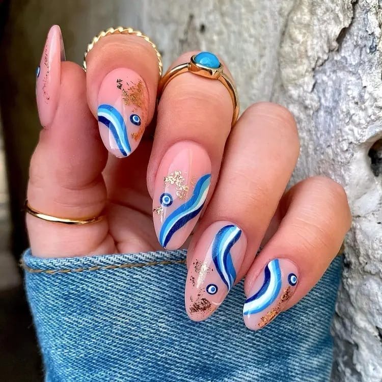 Evil Eye Swirls nails with gold foil
