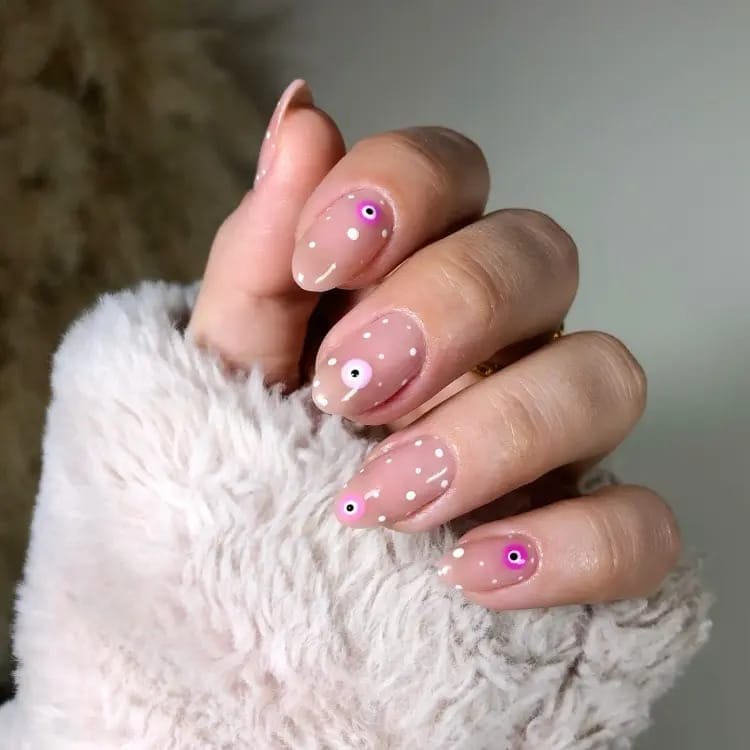 The pink Evil Eye Nails  