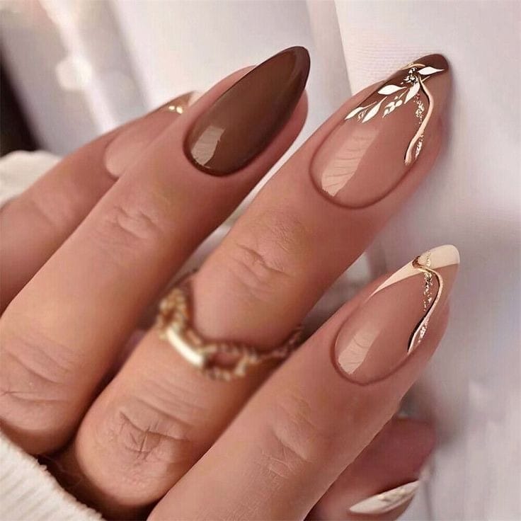 Brown Almond Nails With Gold Leaves